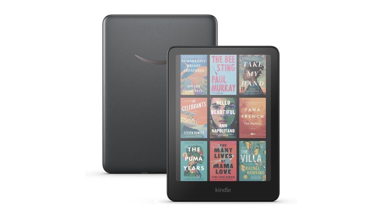 The Kindle Colorsoft is turned on and shows a grid of full-color books