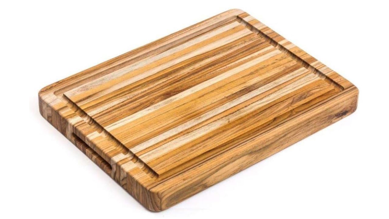 Teakhaus Wood Cutting Board with Juice Groove against a white background